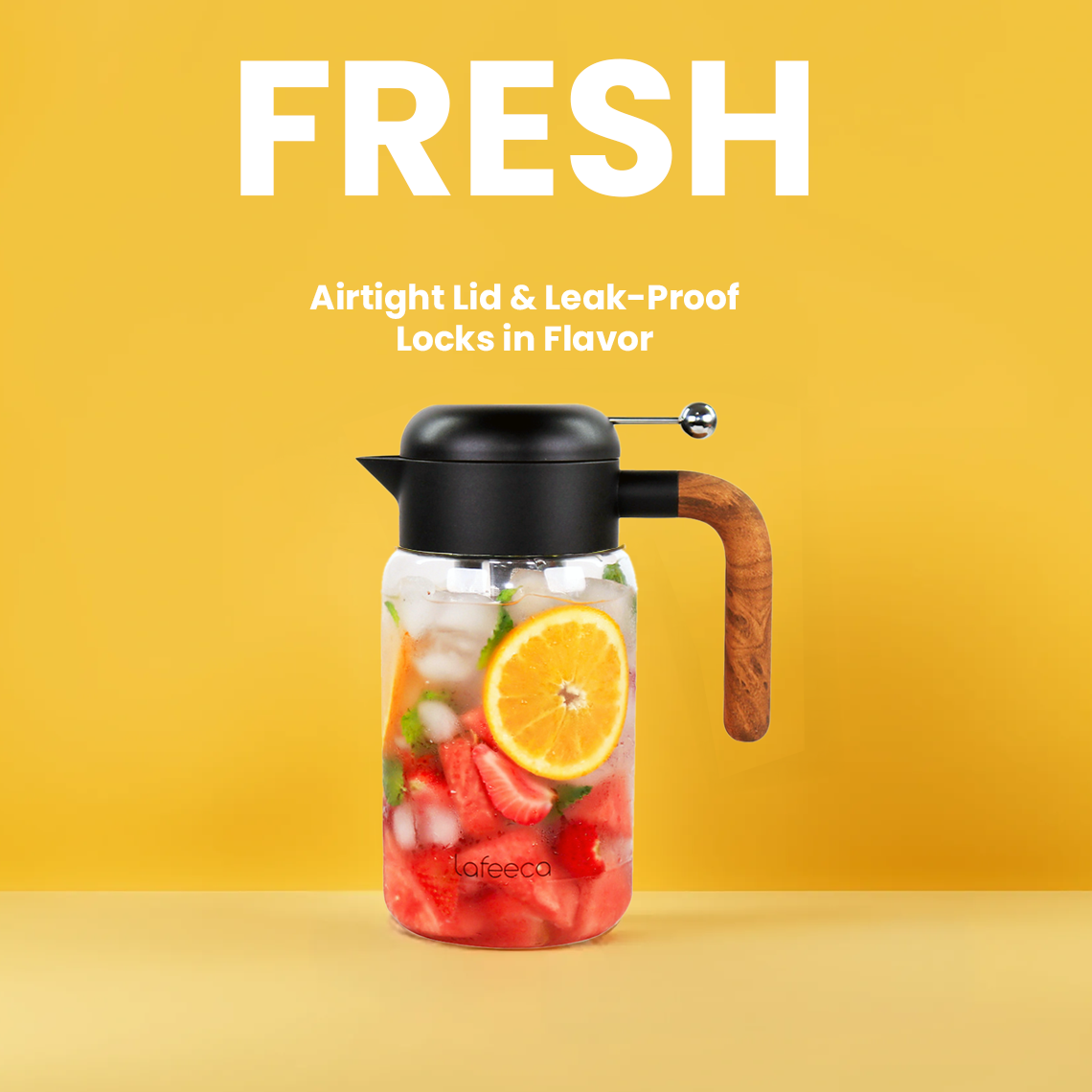 Black Lafeeca Essence cold-brew pitcher holding iced fruit infusion on a yellow background